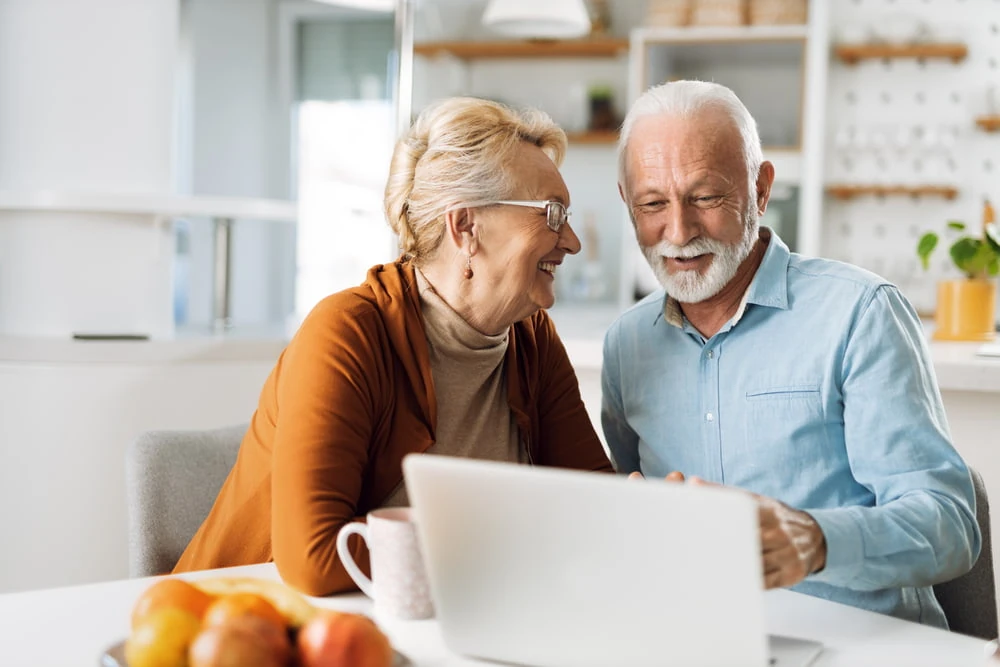 senior couple using computer