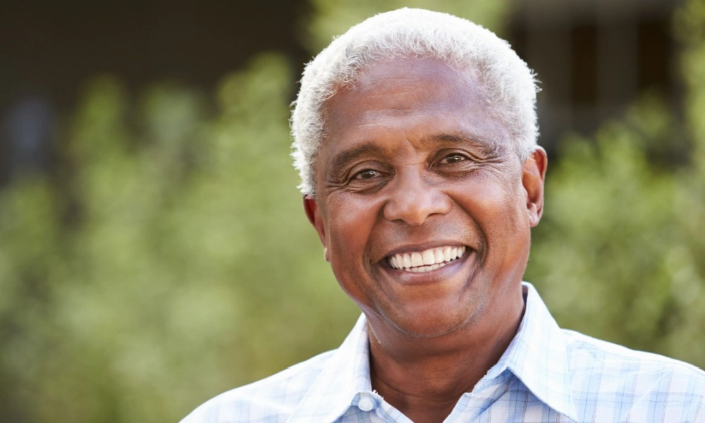 senior man outdoors smiling