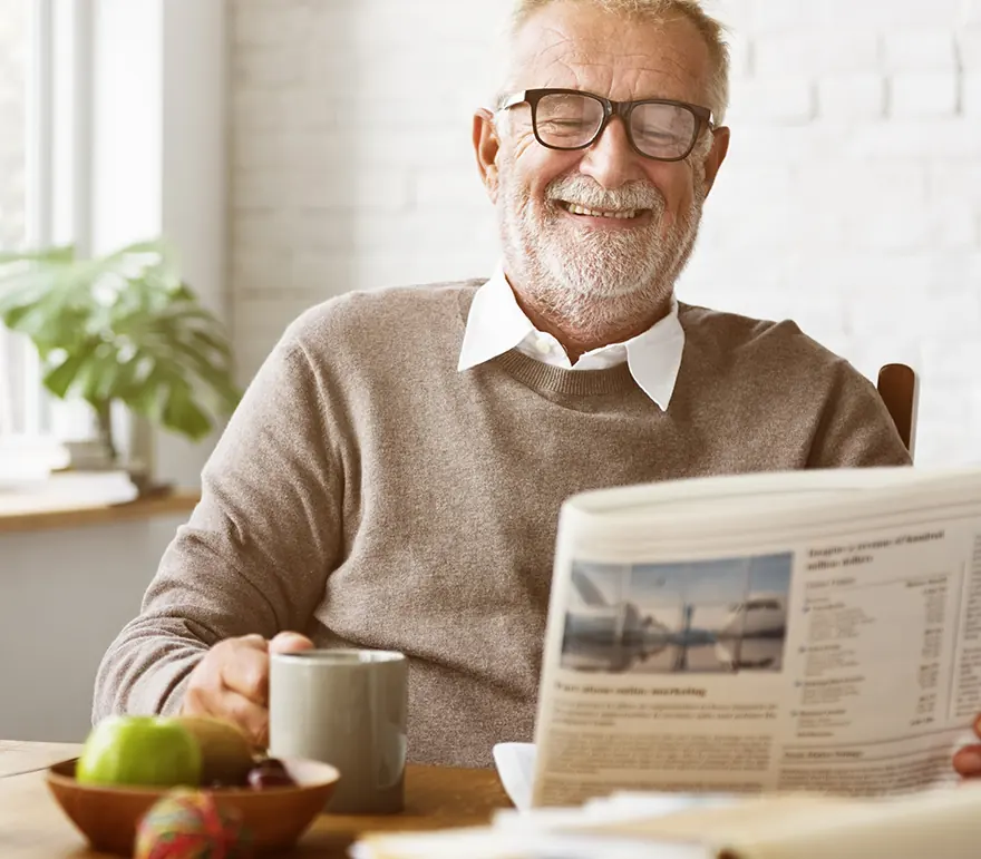 senior man reading the newspaper