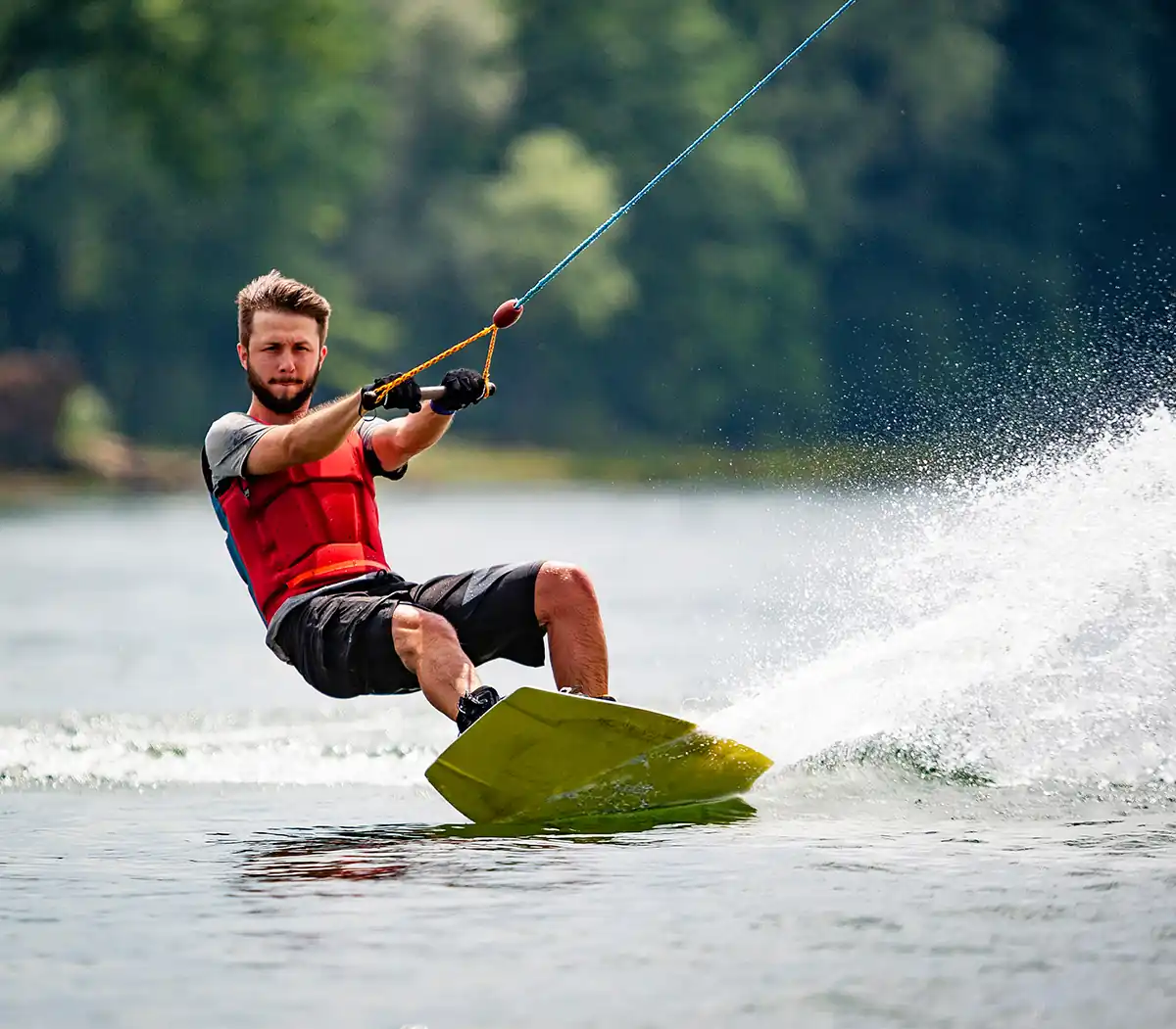 man wakeboarding on the lake