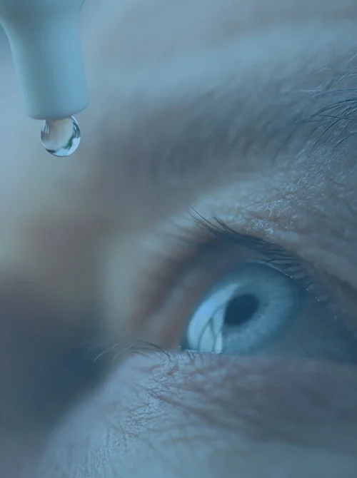 man using eye drops for dry eye