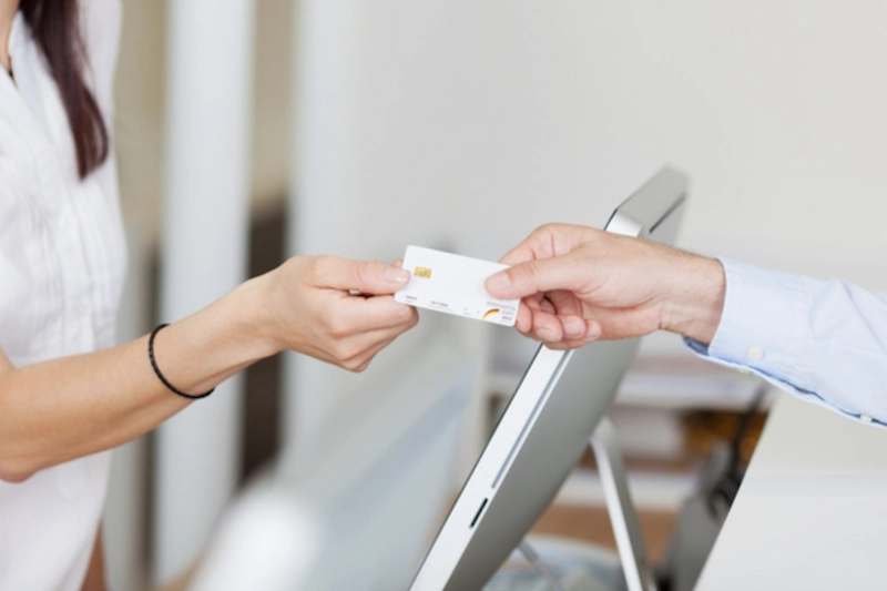 patient paying at doctor's office with credit card