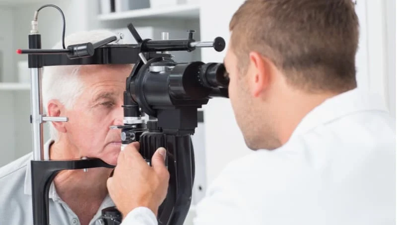 senior man having eyes checked at the ophthalmologist
